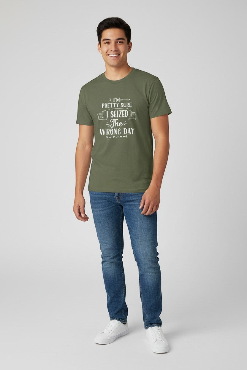 Jena Jewelry olive green 100% US cotton t-shirt with 'I Seized the Wrong Day' graphic print. Model is wearing jeans and white sneakers.