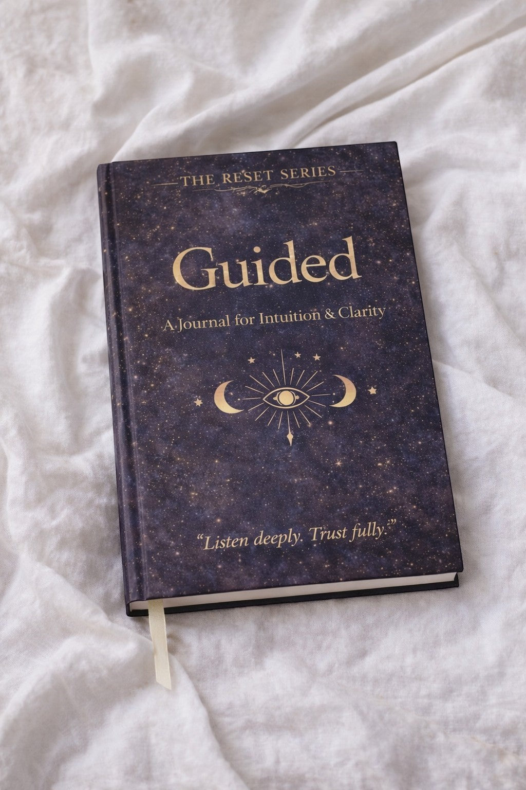 Jena Jewelry Guided journal with a dark starry cover, gold text, and celestial eye design. For personal growth and reflection.