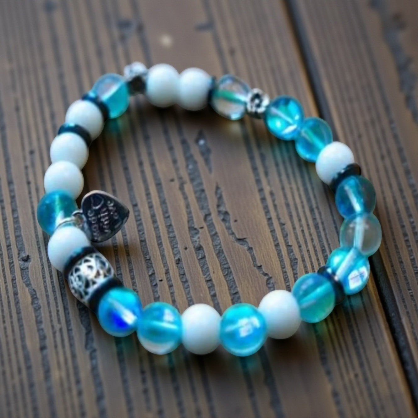 Jena Jewelry "Let It Go!" stretch bracelet with blue mermaid beads, snow jade, and hematite, spelling out Morse code.