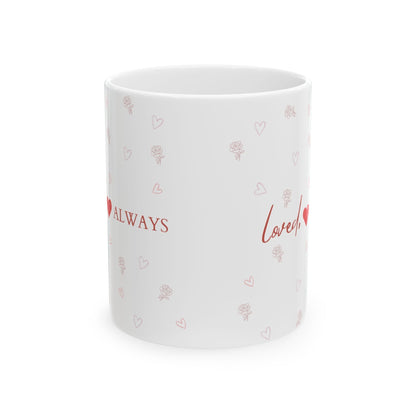Jena Jewelry white ceramic mug with red "Loved Always" text and small heart and rose pattern. Ideal for gifts.