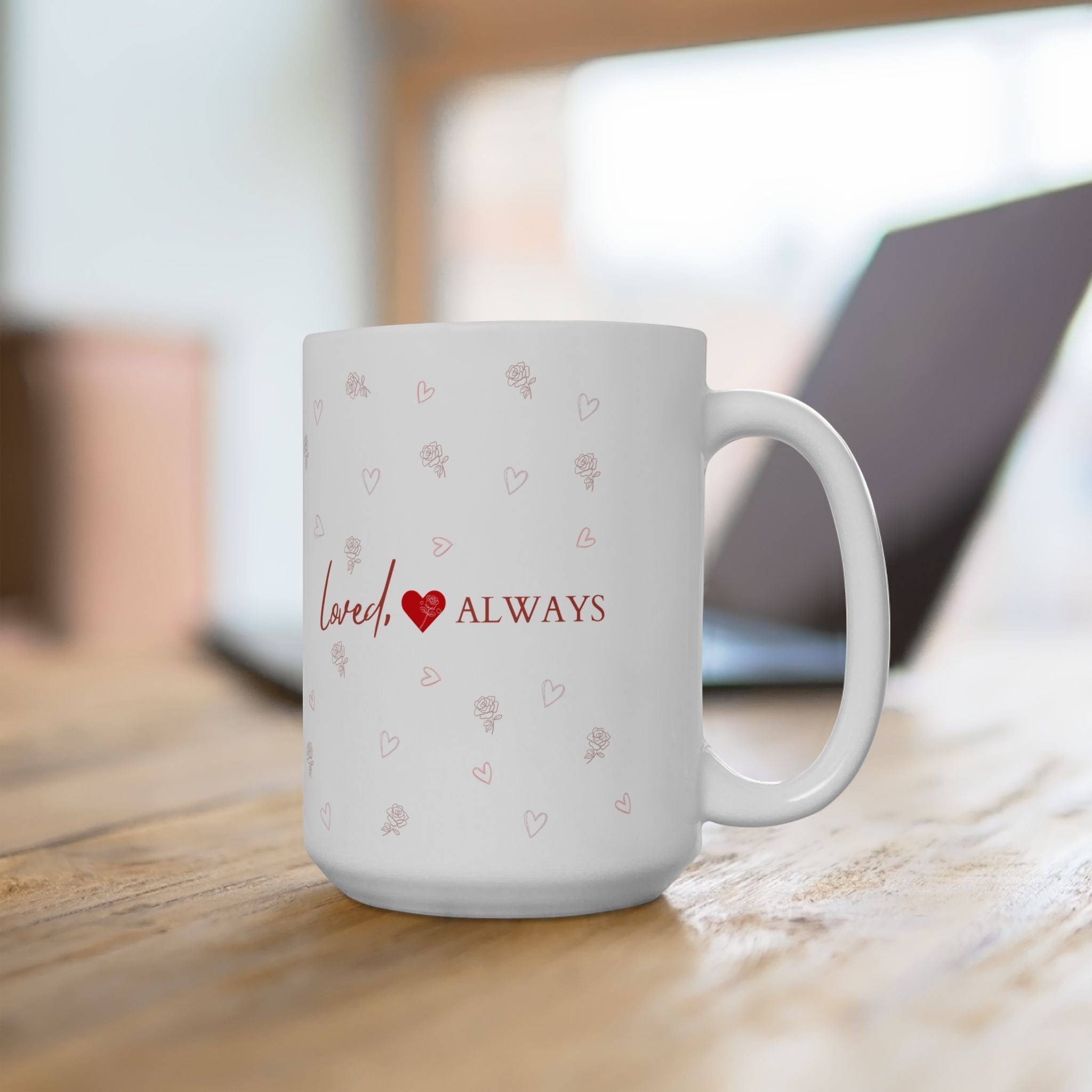 Jena Jewelry white ceramic mug with red "Loved Always" text, heart, and rose pattern. Perfect for gifts.