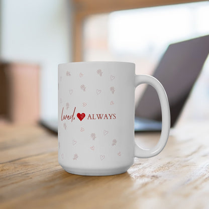 Jena Jewelry white ceramic mug with red "Loved Always" text, heart, and rose pattern. Perfect for gifts.