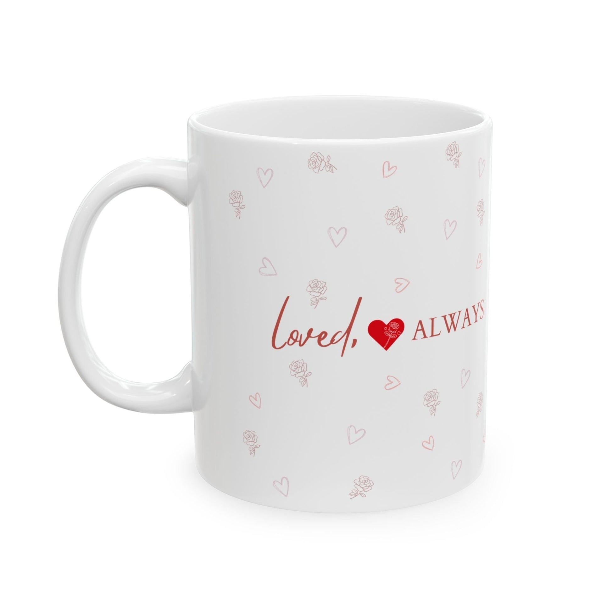 Jena Jewelry white ceramic mug with a red "Loved Always" text and heart design, scattered with small pink hearts and roses.