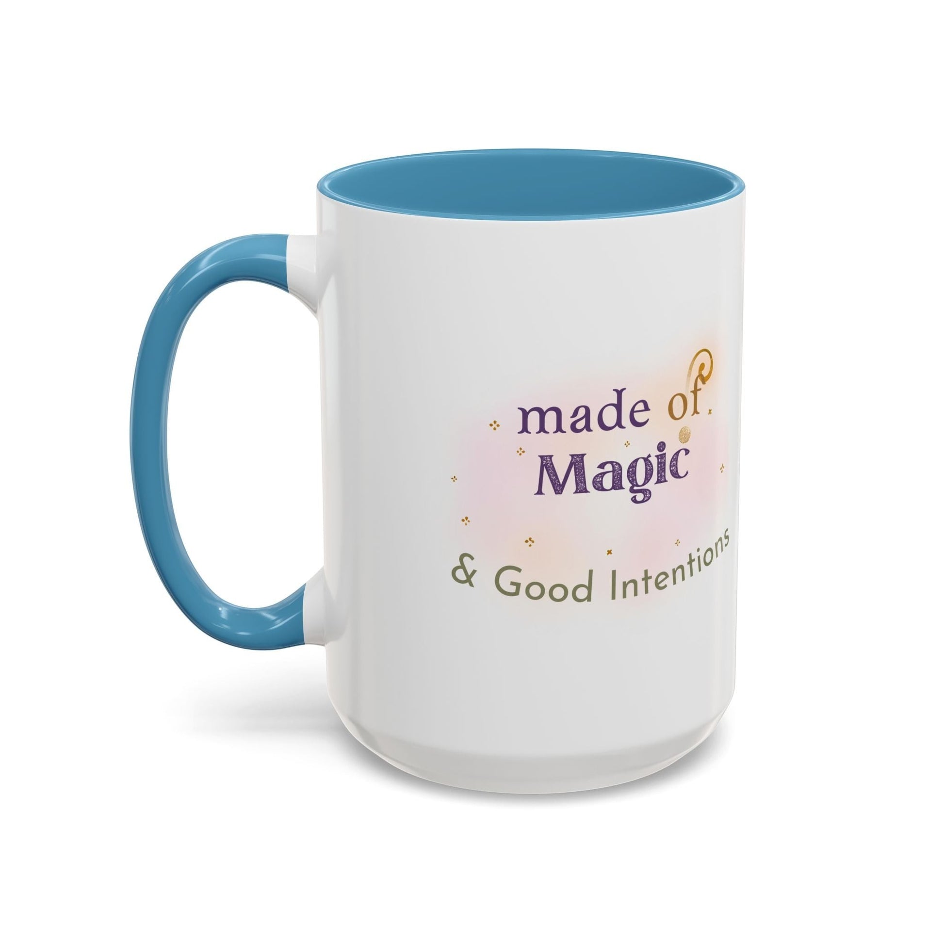 Jena Jewelry white ceramic mug with blue interior and handle, featuring "Made of Magic & Good Intentions" text and watercolor accents.