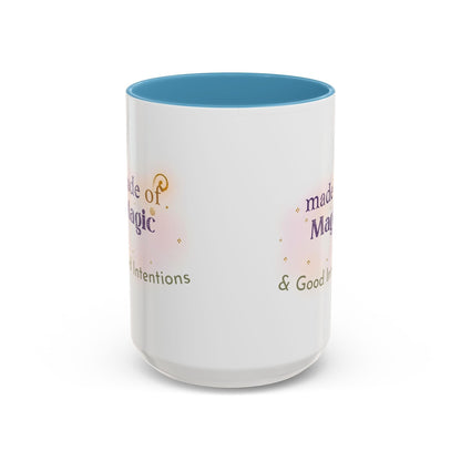 Jena Jewelry white ceramic mug with blue interior, featuring "Made of Magic" text and watercolor accents.