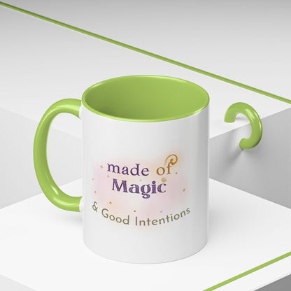 Jena Jewelry white ceramic mug with green interior and handle, featuring "made of Magic & Good Intentions" text.