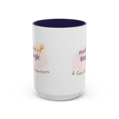 Jena Jewelry white ceramic mug with navy interior, featuring the text "Made of Magic" and "Good Intentions" with watercolor accents.