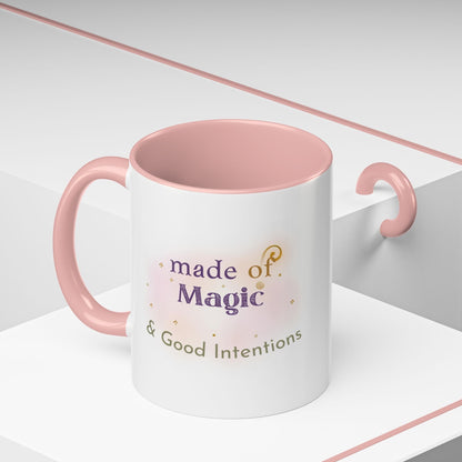 Jena Jewelry white ceramic mug with pink interior and handle, featuring "made of Magic & Good Intentions" text.