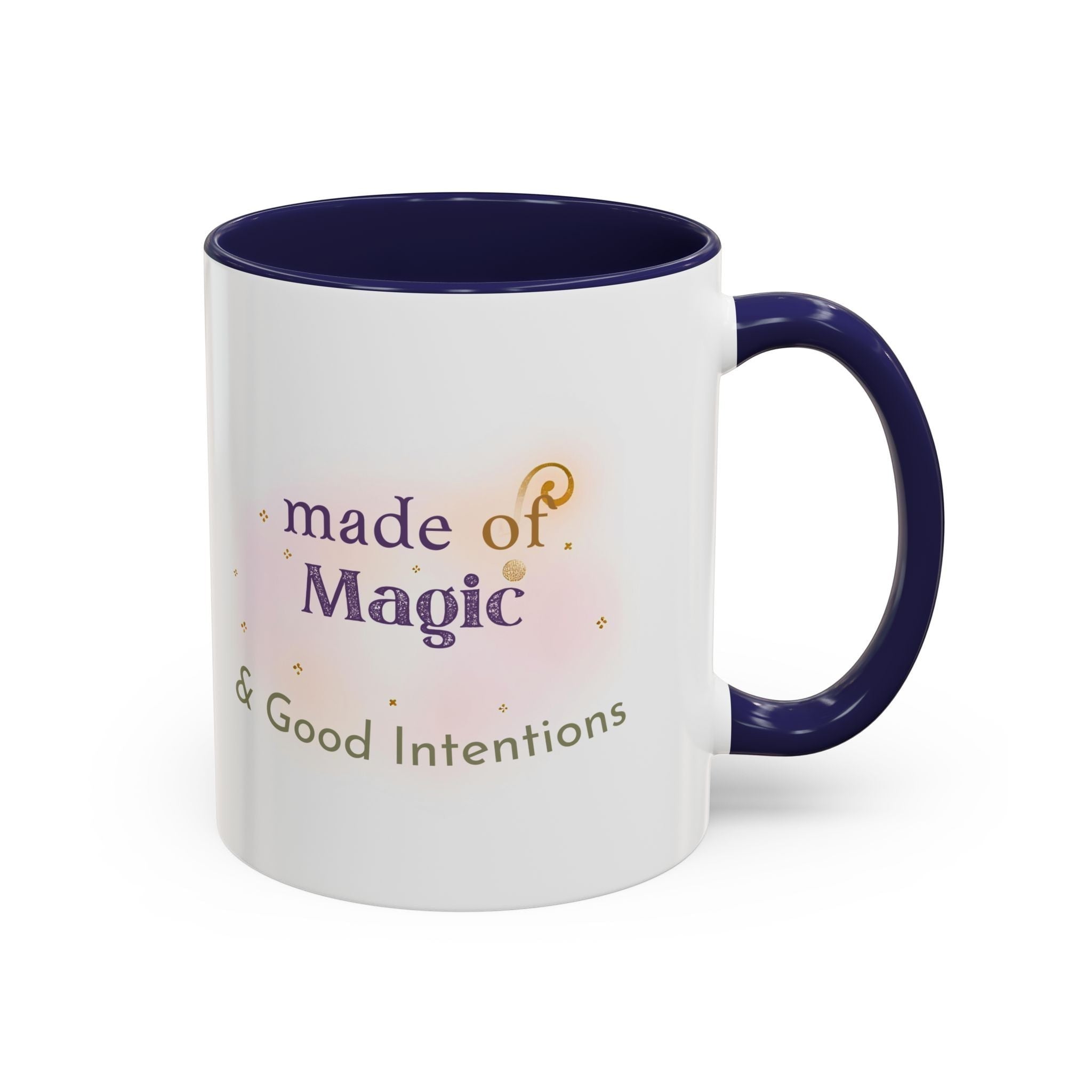 Jena Jewelry white ceramic mug with navy blue interior and handle, featuring "made of Magic & Good Intentions" text and watercolor accents.