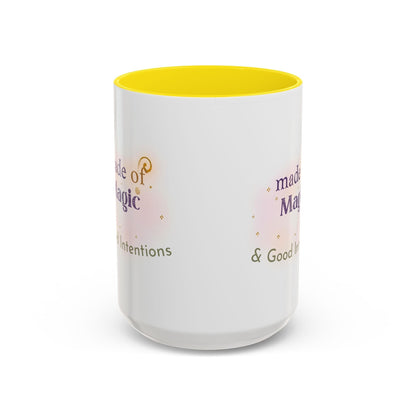 Jena Jewelry white ceramic mug with yellow interior, featuring the text "Made of Magic" and "Filled Intentions & Good Intentions" in purple and green.