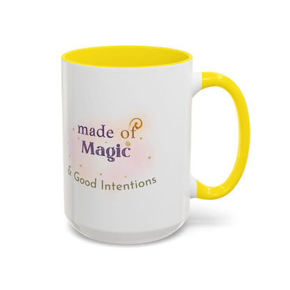 Jena Jewelry white ceramic mug with yellow handle and interior, featuring "Made of Magic & Good Intentions" text and watercolor design.