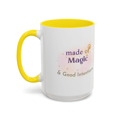Jena Jewelry white ceramic mug with yellow interior and handle, featuring "made of Magic & Good Intentions" text and watercolor accents.