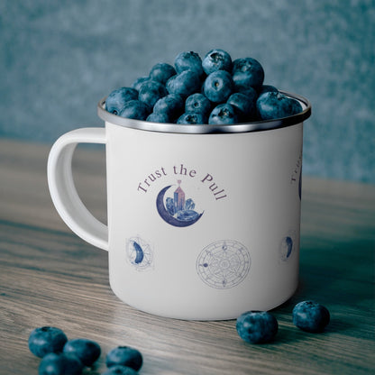 Jena Jewelry white enamel camping mug with moon phase and crystal design, filled with blueberries.