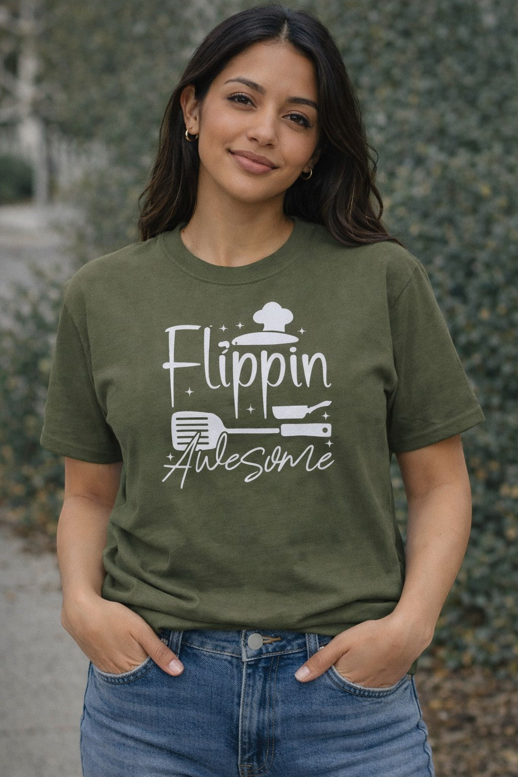 Jena Jewelry olive green 100% cotton t-shirt with white "Flippin Awesome" graphic featuring a chef hat, spatula, and pan.