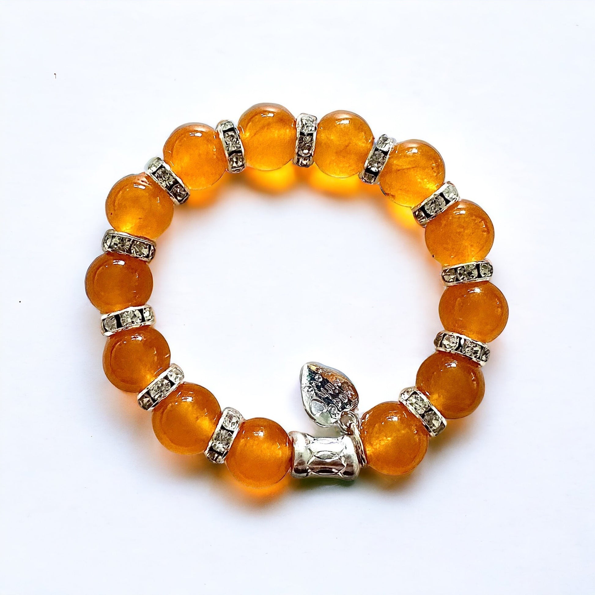 Jena Jewelry orange jade beaded bracelet with rhinestone spacers and a silver heart charm.