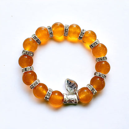 Jena Jewelry orange jade beaded bracelet with rhinestone spacers and a silver heart charm.
