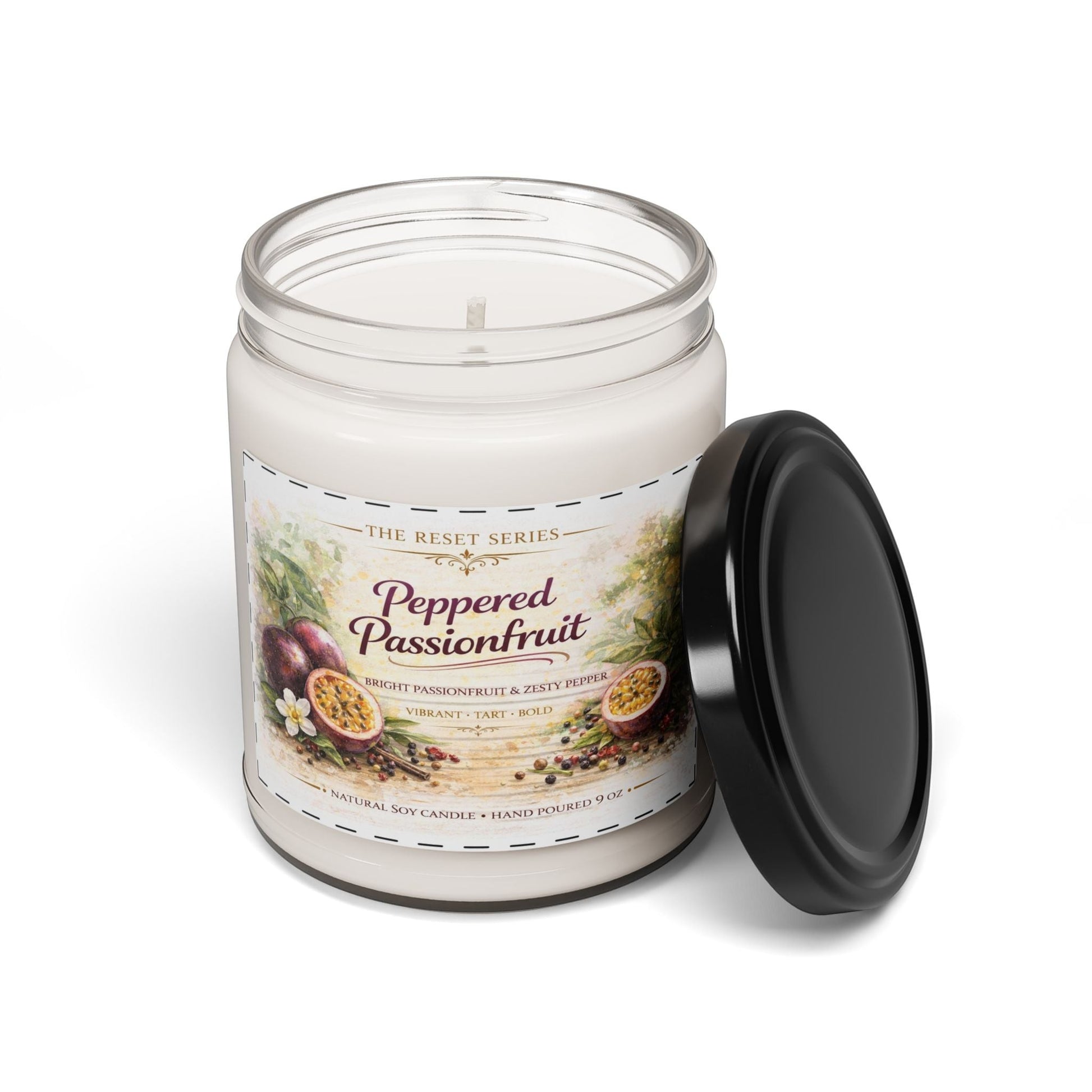 Jena Jewelry Peppered Passionfruit natural soy candle in a clear glass jar with a black lid. Features passionfruit and pepper illustration.