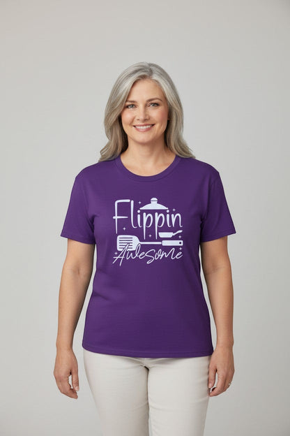 Jena Jewelry purple 100% cotton t-shirt with white graphic text 'Flippin Awesome' and cooking icons. Model is wearing a size L.