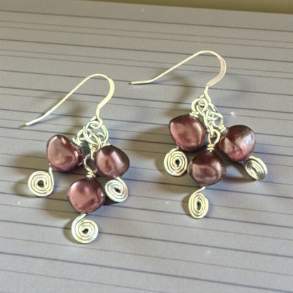 Jena Jewelry deep red freshwater pearl drop earrings with silver-tone wire wrapping and spiral details.