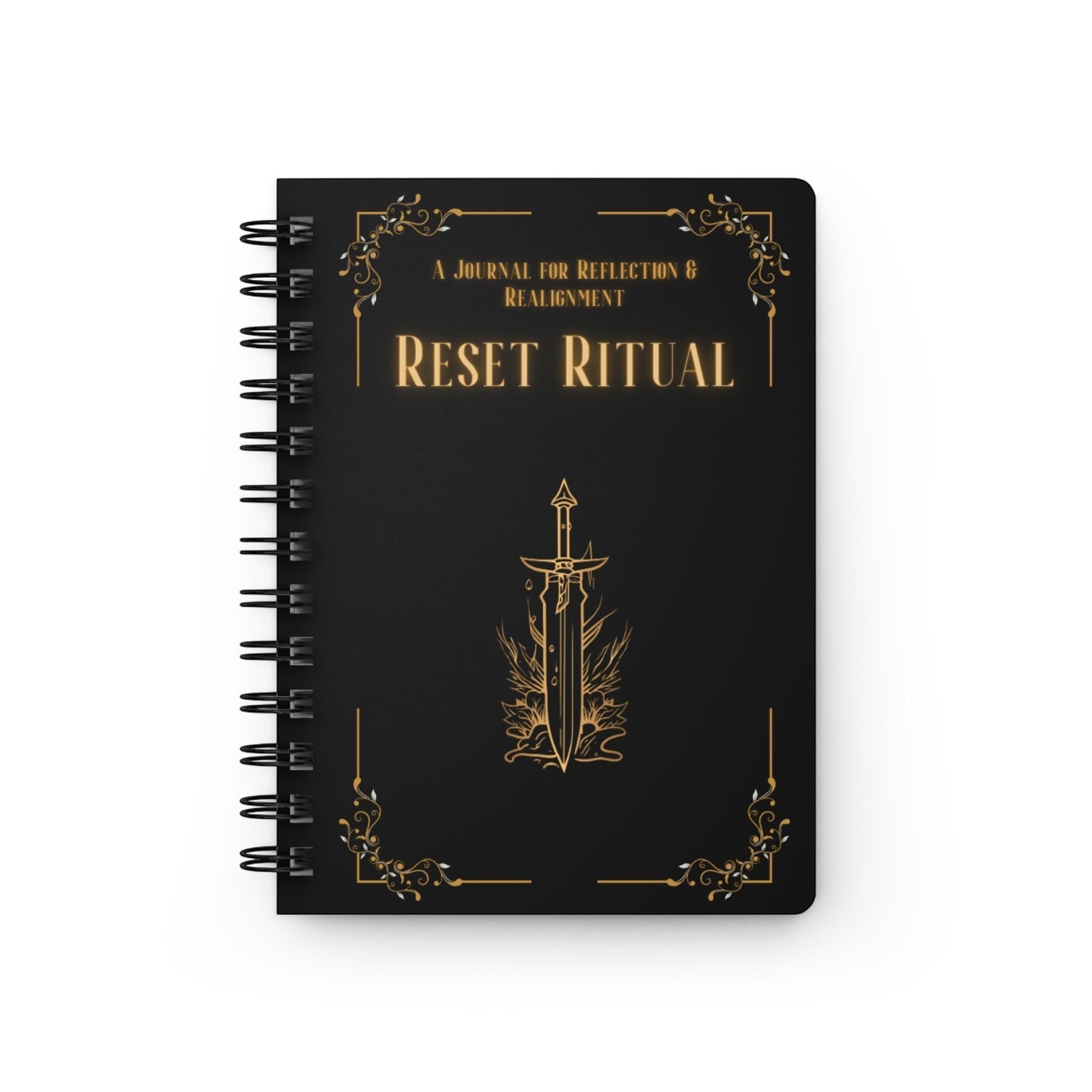 Jena Jewelry Reset Ritual spiral notebook with black cover, gold text and sword emblem. For self-care and goal setting.