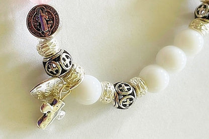 Jena Jewelry snow jade and rose quartz rosary bracelet with silver plate spacers and St. Benedict medal.