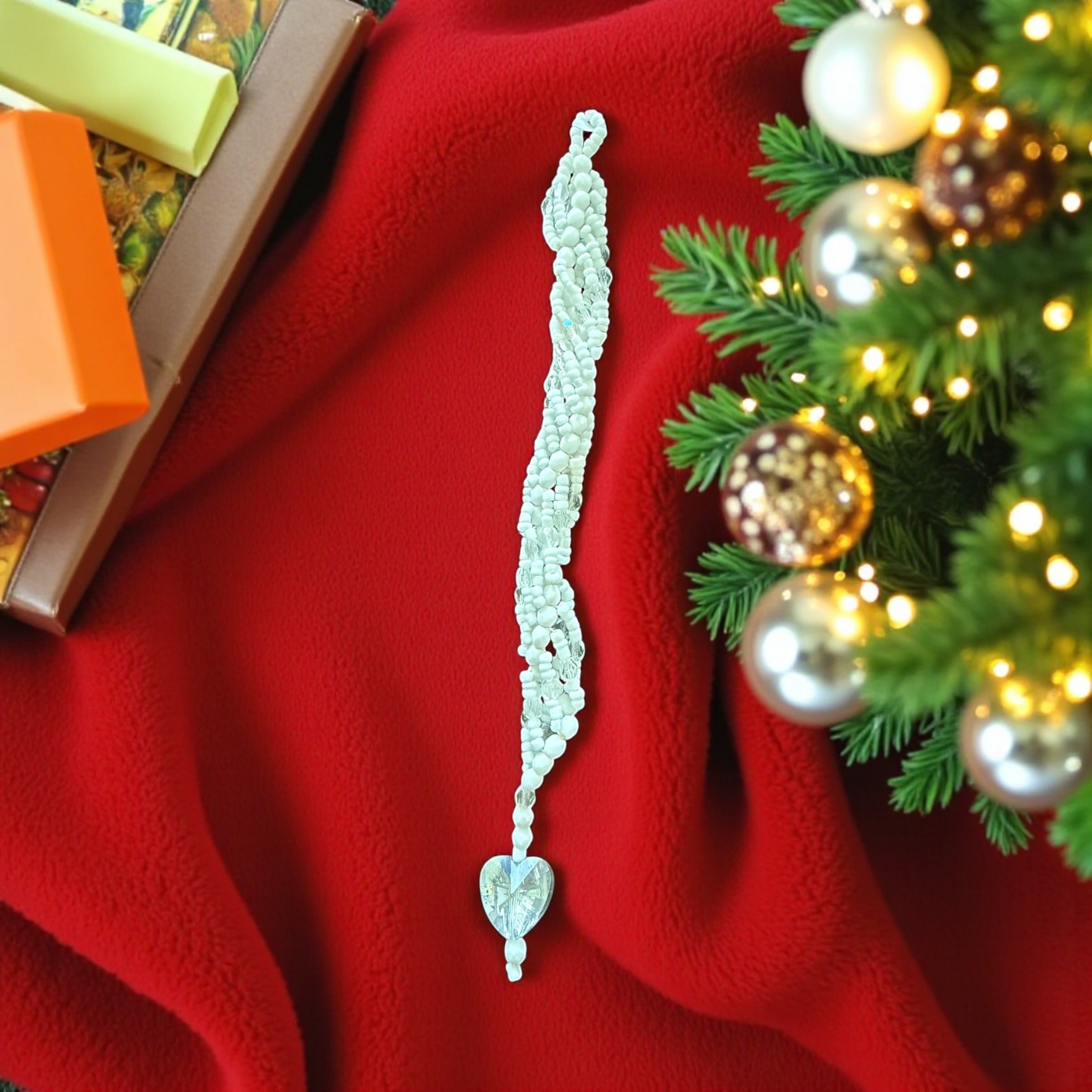 Jena Jewelry white seed bead icicle ornament with a clear glass heart charm, handcrafted for holiday sparkle.