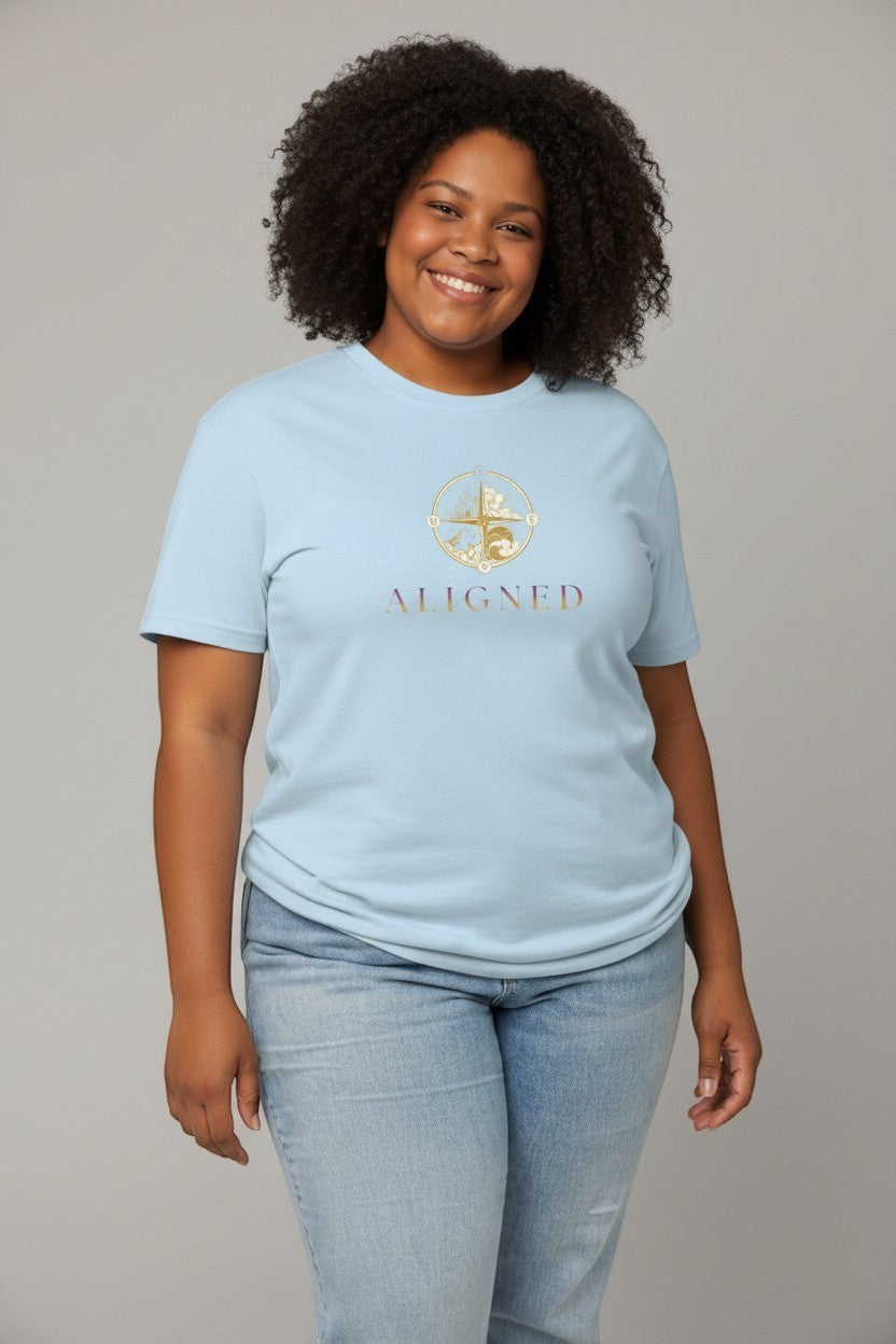 Woman wearing light blue “Aligned” t-shirt, a peaceful and relaxed casual look.