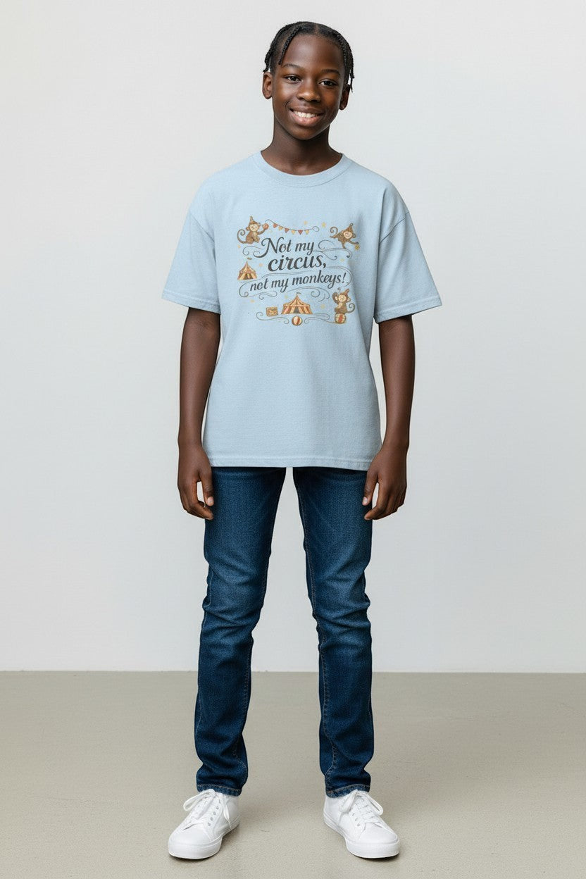 Young person wearing light blue “Not My Circus Not My Monkeys” t-shirt, a fun and casual graphic tee.