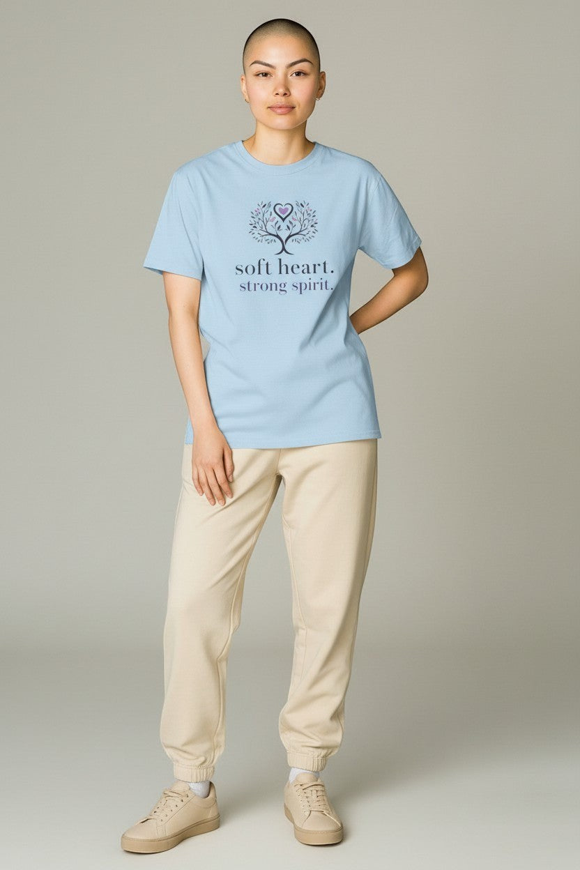 Woman wearing light blue “Soft Heart Strong Spirit” t-shirt, a soft and calming motivational outfit.