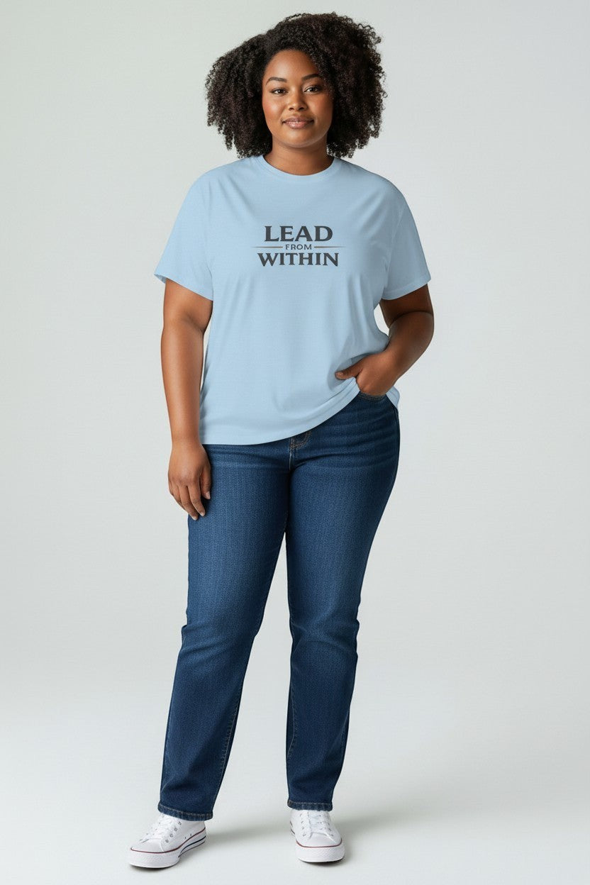 Woman wearing light blue “Lead From Within” t-shirt, a relaxed and empowering everyday outfit.