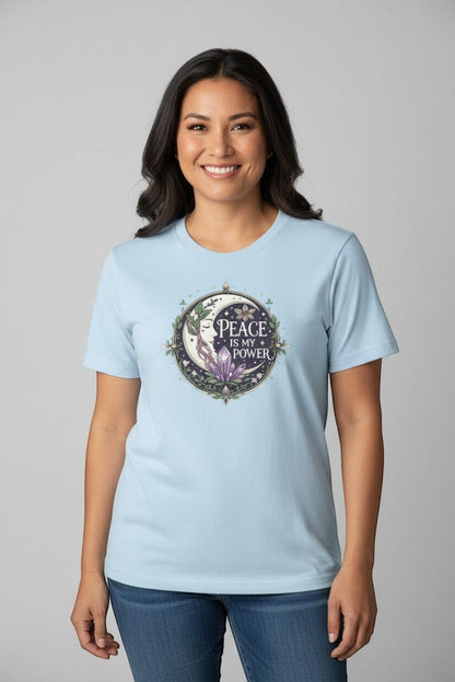 Woman wearing light blue peace affirmation t-shirt, a soft and uplifting casual style.