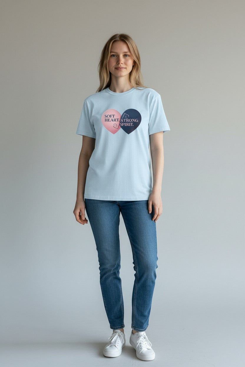 Woman wearing light blue “Soft Heart Strong Spirit” t-shirt, a soft and peaceful outfit.
