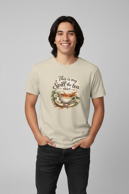 Man wearing sand-colored “Spill the Tea” shirt, a neutral and versatile graphic tee for everyday style.