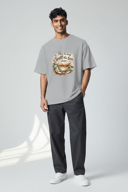 Man wearing sport grey “Spill the Tea” t-shirt in a relaxed fit, perfect for laid-back and comfortable outfits.