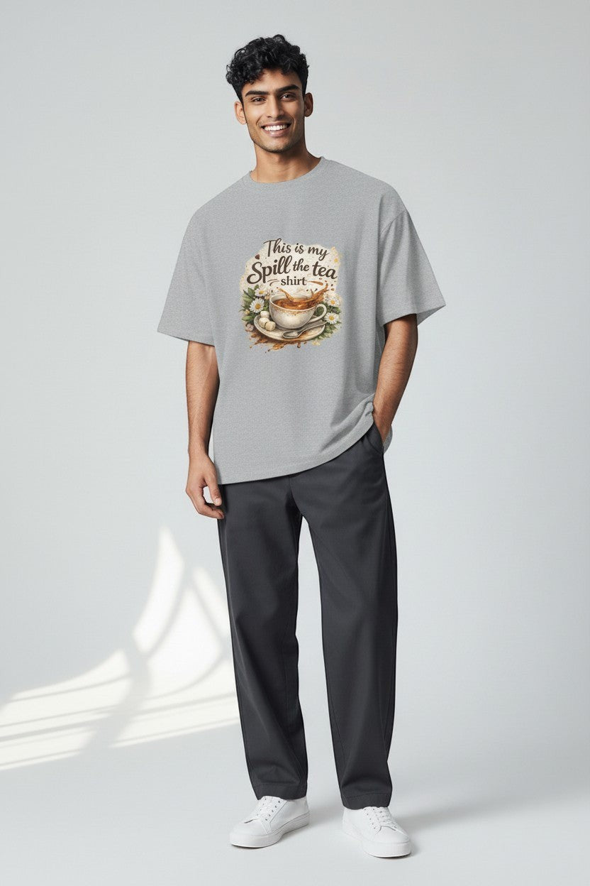 Man wearing sport grey “Spill the Tea” t-shirt in a relaxed fit, perfect for laid-back and comfortable outfits.
