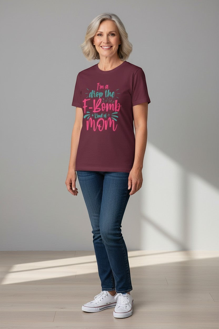 Woman wearing maroon “Drop the F-Bomb Mom” t-shirt, a confident and playful look.