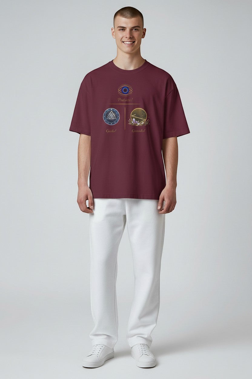 Man wearing maroon t-shirt with symbolic graphic artwork, a rich and bold everyday style.