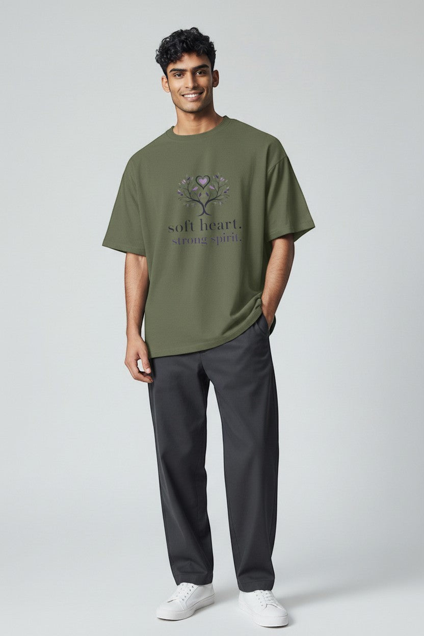 Man wearing military green “Soft Heart Strong Spirit” t-shirt, a grounded and natural style with a positive message.