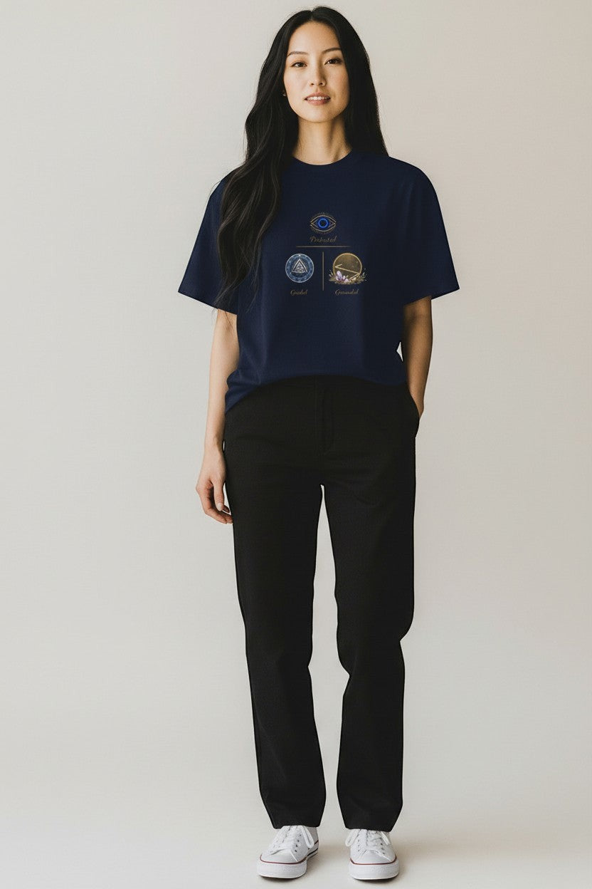 Woman wearing navy blue t-shirt featuring a symbolic graphic, a sleek and versatile everyday look.
