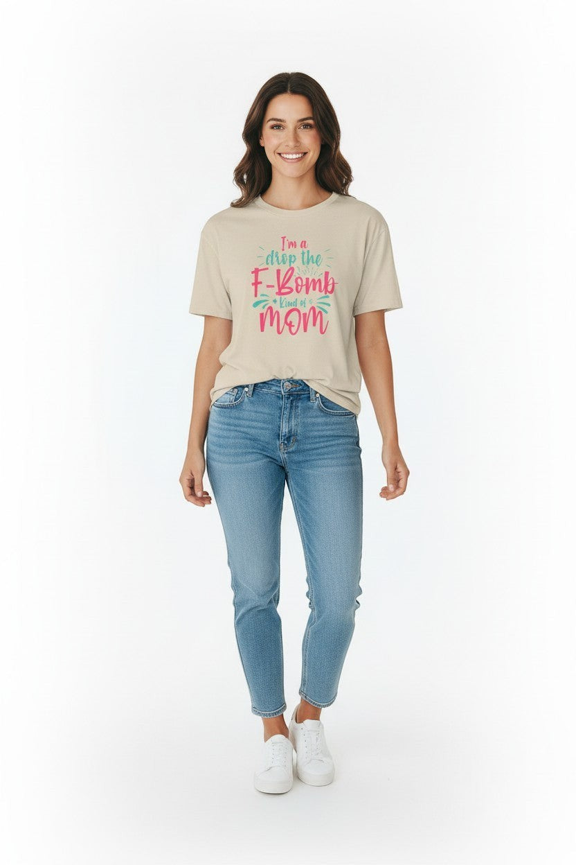 Woman wearing sand “Drop the F-Bomb Mom” t-shirt, a soft and everyday mom look.