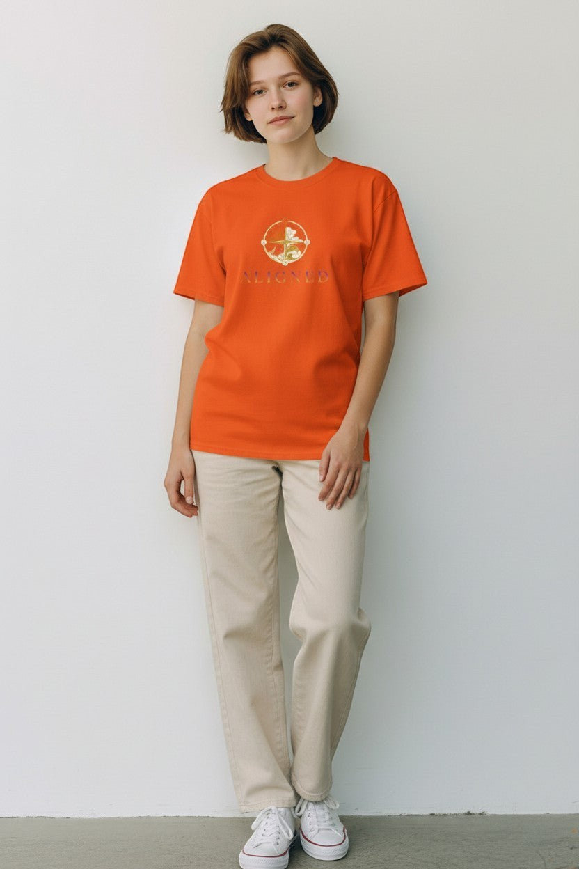 Woman wearing orange “Aligned” t-shirt, a vibrant and confident mindful look.