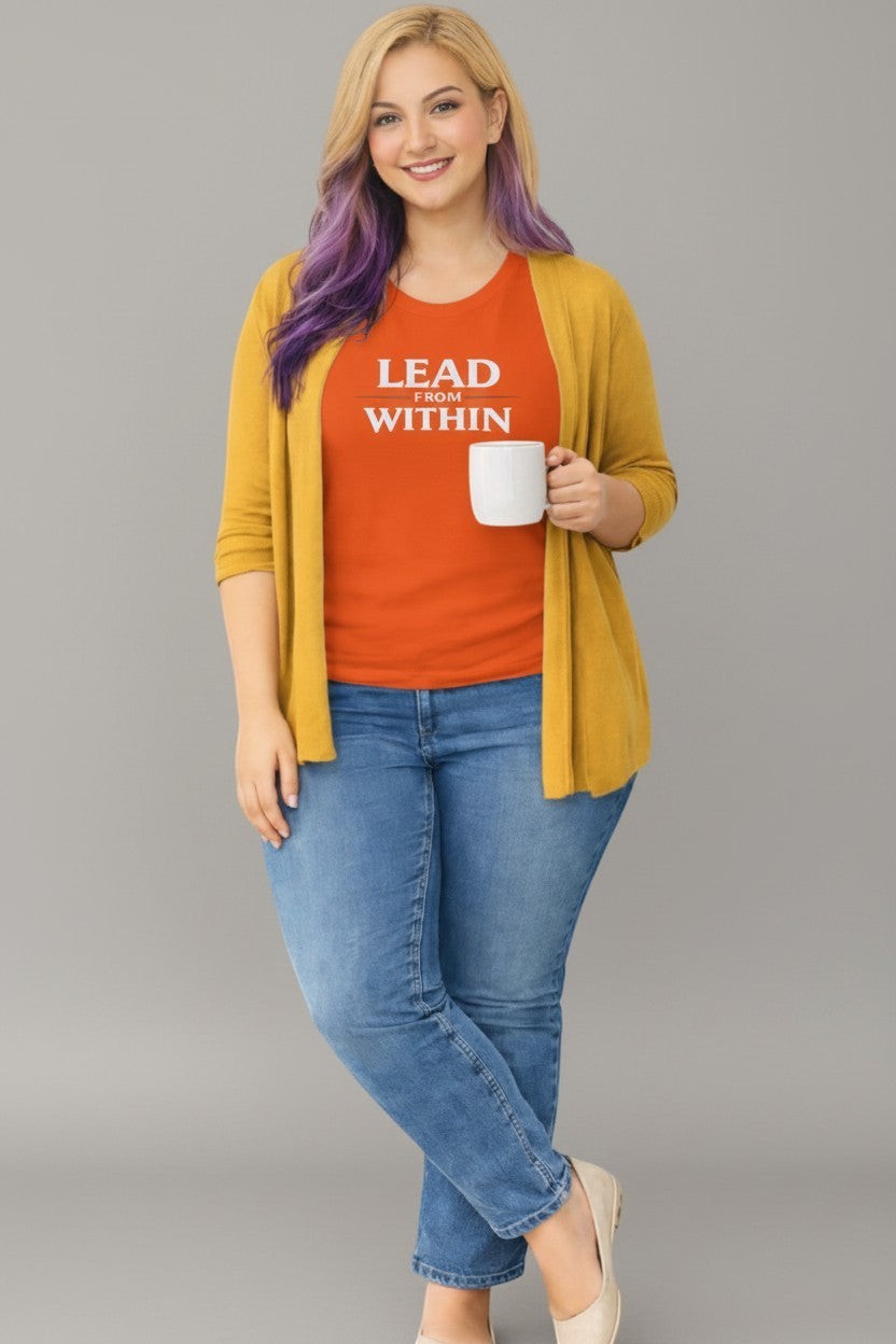 Woman wearing orange “Lead From Within” t-shirt, a bright and confident everyday style.