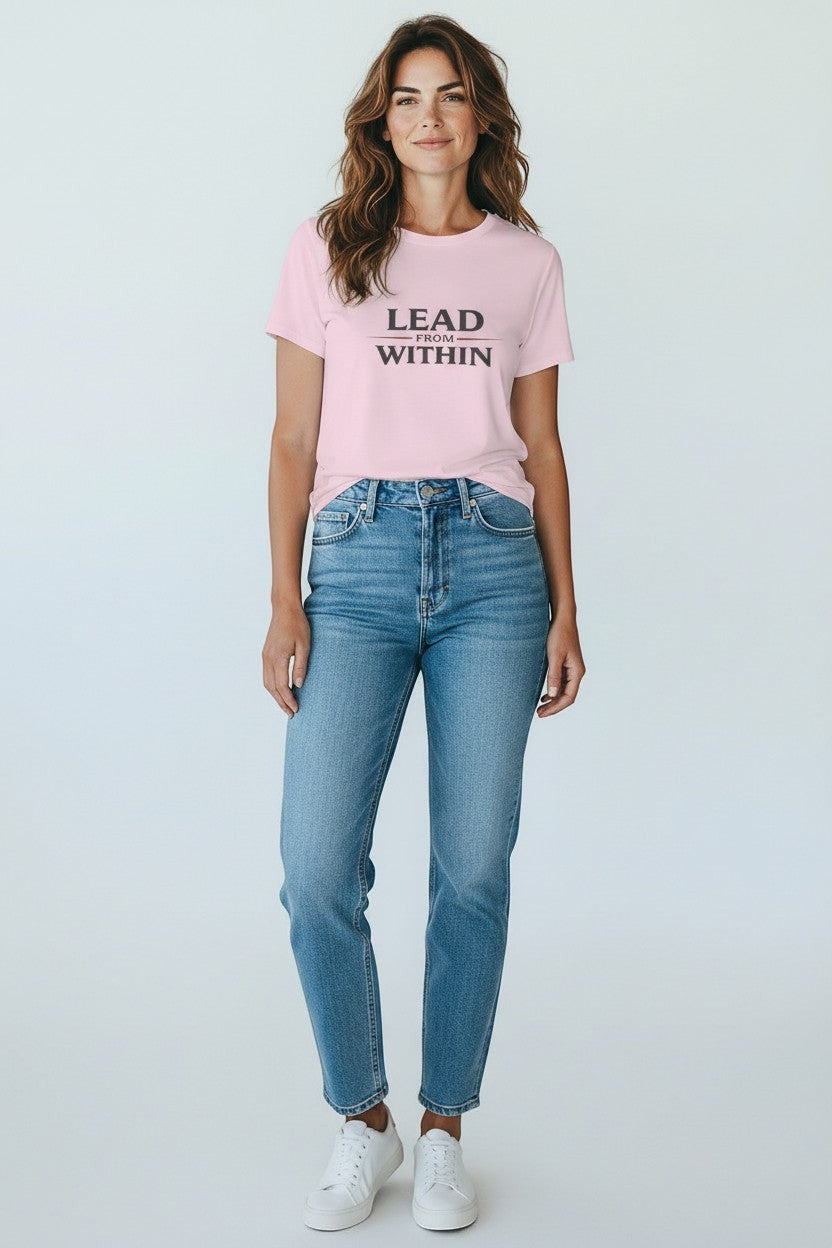 Woman wearing pink “Lead From Within” t-shirt, a soft and confident casual style.