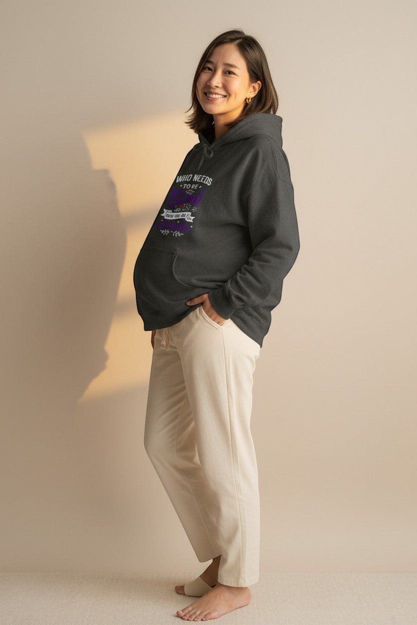 Pregnant woman wearing a cozy hoodie, perfect for comfortable maternity outfits and everyday wear.