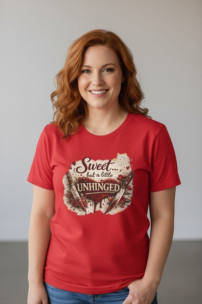 Woman wearing red “Sweet but a Little Unhinged” shirt, a bold and playful graphic tee.