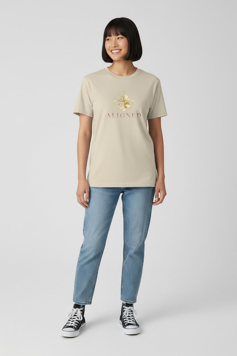 Woman wearing sand-colored “Aligned” t-shirt, a soft and balanced everyday style.