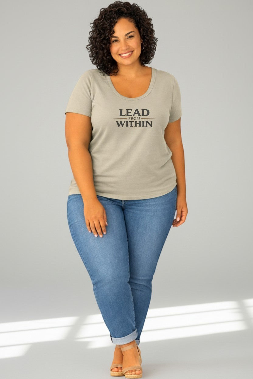 Woman wearing sand-colored “Lead From Within” t-shirt, a warm and approachable everyday look.