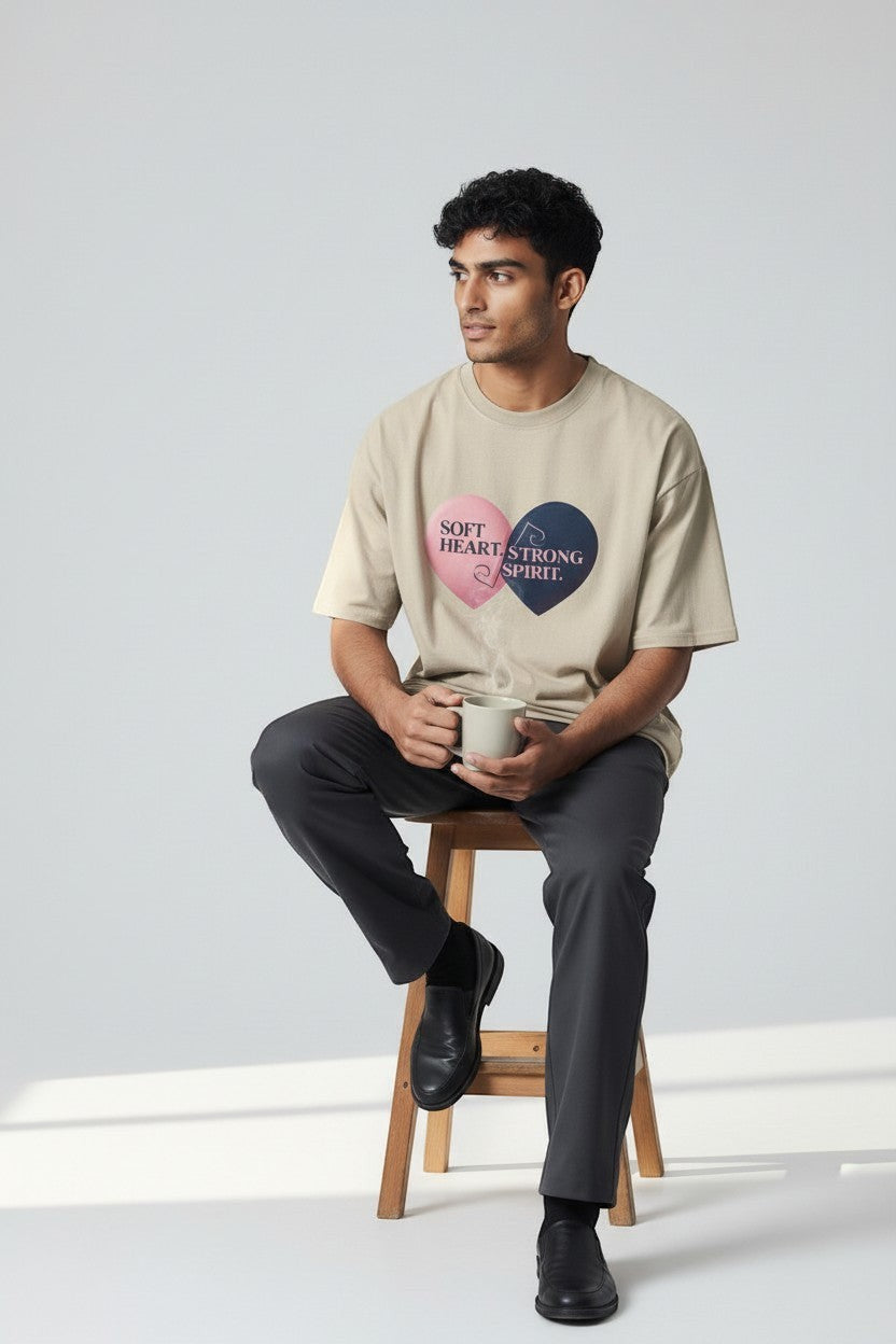 Man wearing sand “Soft Heart Strong Spirit” t-shirt, a soft and balanced everyday style.