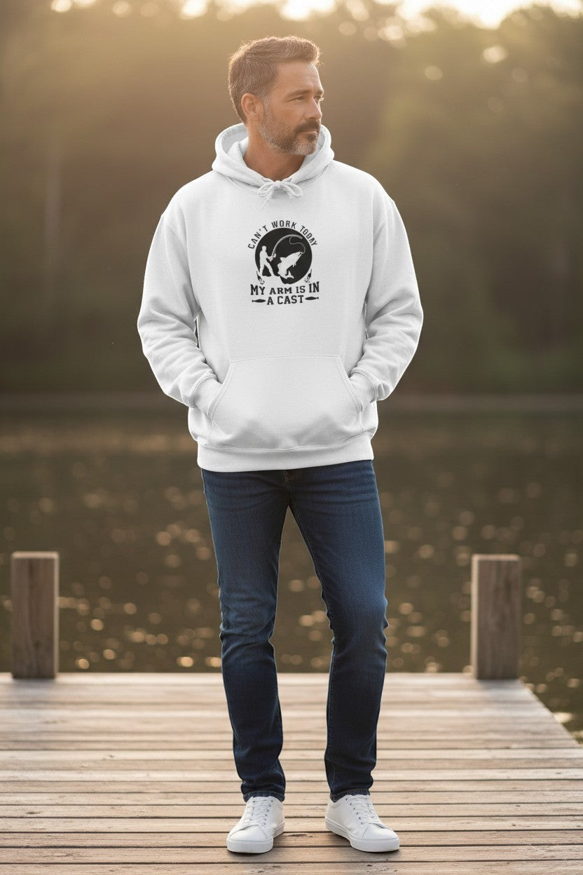 Man wearing white graphic hoodie outdoors on a dock, styled for a cozy and casual everyday outfit.