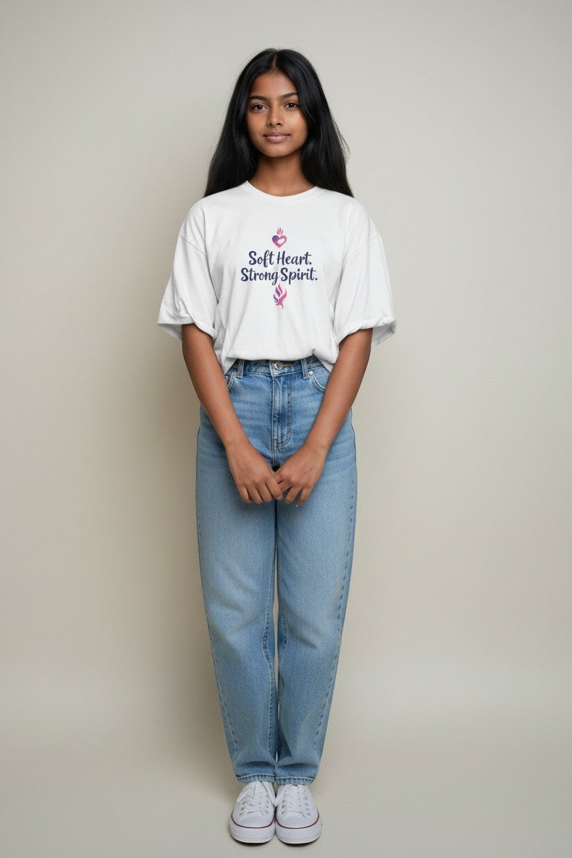 Woman wearing white “Soft Heart Strong Spirit” t-shirt, a clean and uplifting graphic tee.